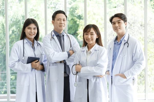 Healthcare professionals smiling together in a modern medical setting